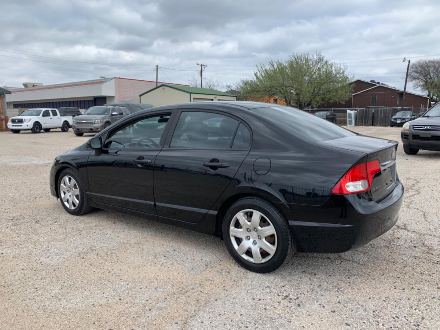 2010 Black /gray Honda Civic LX Sedan (19XFA1F56AE) with an 1.8L L4 SOHC 16V engine, Automatic transmission, located at 1830 North Belt Line Road, Irving, TX, 75061, (469) 524-0199, 32.834373, -96.993584 - Photo#3